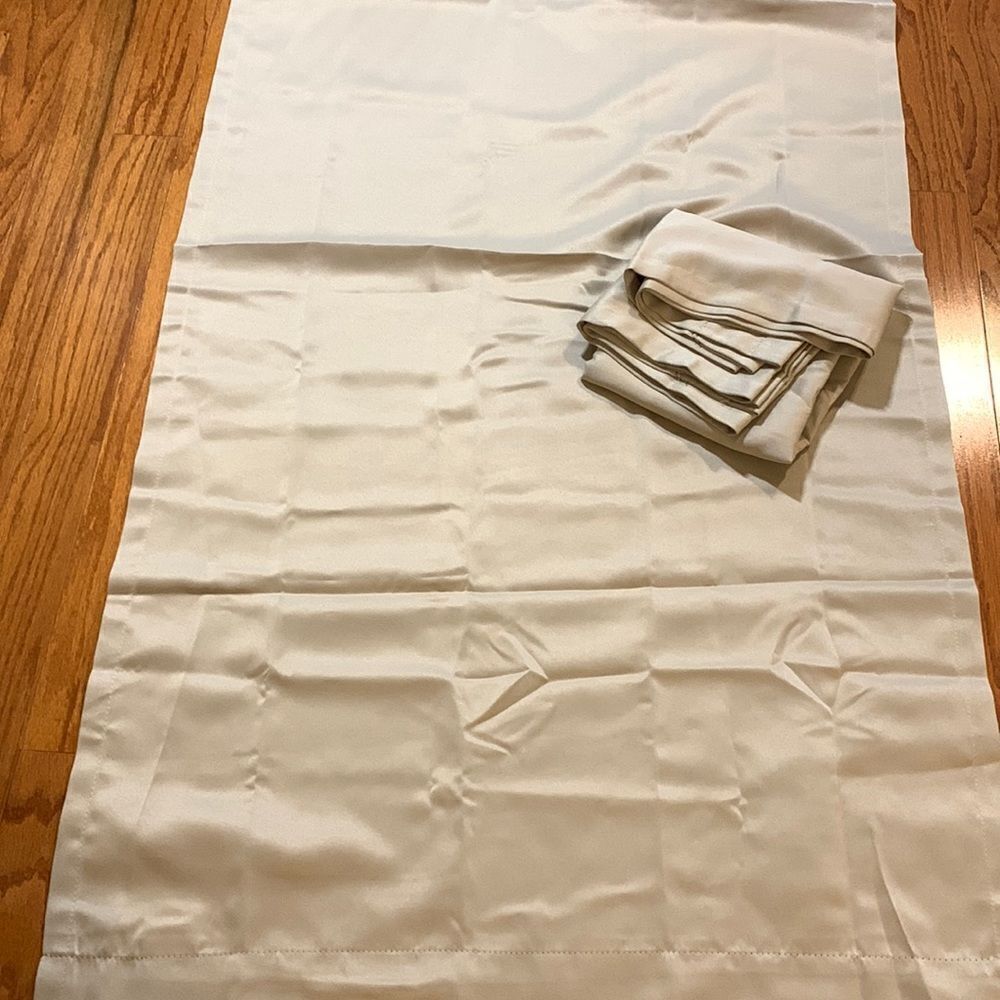 One pair of room darkening tan colors 30" x 63 Curtains.